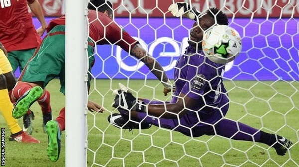 Togo goalkeeper Kossi Agassa watches as the ball goes past him for Morocco's second goal