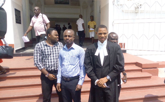  Mr Eric Asante (middle) with his lawyer, Mr Francis Xavier Sosu, after the judgement. Picture: EMMANUEL EBO HAWKSON