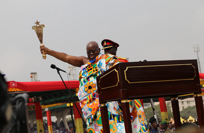  President Akufo-Addo holds aloft the State Sword to conclude the swearing-in ceremony at the Black Star Square last Saturday. Pictures: EBOW HANSON & SAMUEL TEI ADANO