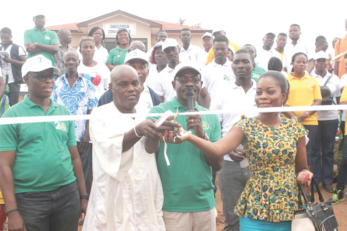 •Rev. William Tsingo (3rd left), together with Ms Marian Ofosu Appiah (right) and Nuumo Nuutsie Yaw II (2nd left), cutting a tape to inaugurate the streetlights (INSET) as Mr Seth Atuguba (left),  looks on. Picture: NII MARTEY M. BOTCHWAY