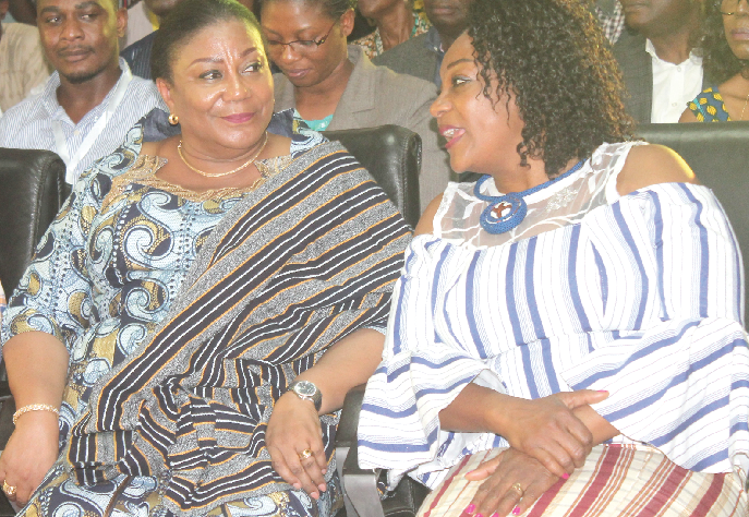 Ms Otiko Afisah Djaba (right) explaining a point to the First Lady, Mrs Rebecca Akuffo-Addo, during the fashion show in Accra. Picture: EDNA ADU-SERWAA