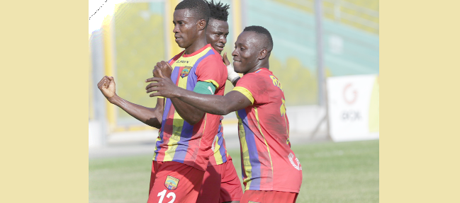 Thomas Abbey (left) is joined by Patrick Razak (right) and Fatawu Mohammed to celebrate his opening goal