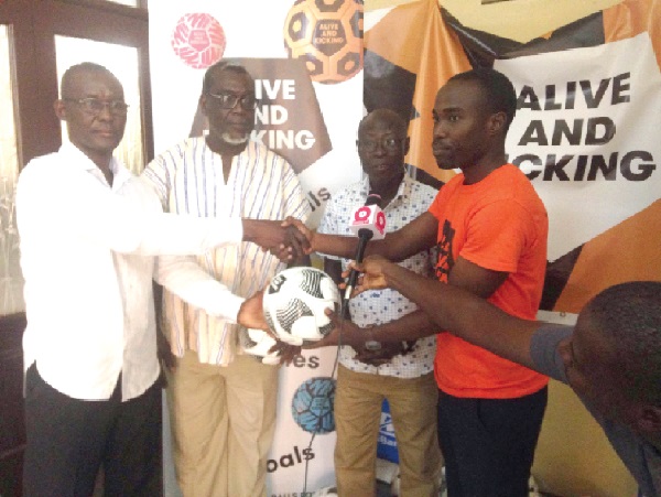 • Mr Wilson Kwabena Duffour (right) presenting the balls to the vice-chairman of GARFA, Mr Gabriel Godwin Quao