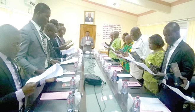 Prof. Kwasi Yankah (head of table) swearing-in the governing council of the University of Health and Allied Sciences in Accra yesterday
