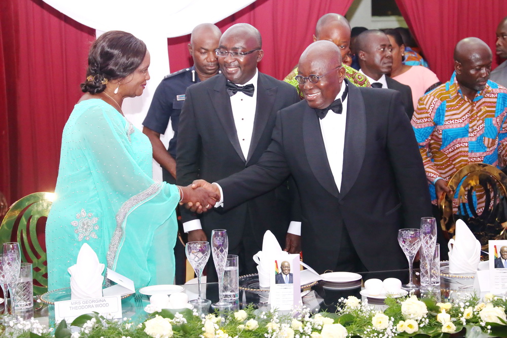 President Akufo-Addo shaking hands with Mrs Justice Georgina Theodora-Wood (left), the immediate past Chief Justice, at a dinner held in her honour. Looking on is Vice-President Mahamudu Bawumia