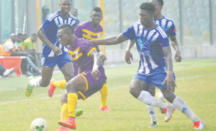 Medeama’s Bismark Oppong shield the ball from his marker.  Picture by: Ebow Hanson