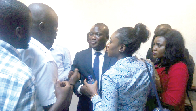 Mr Alhassan Tampoli (middle), Chief Executive Officer,  National Petroleum Authority (NPA), interacting with journalists at the event, after a press conference in Kumasi