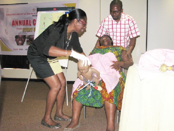 Dr Maame Yaa Nyarko (left), Vice-President of the Paediatric Society of Ghana giving a demonstration on child delivery  at the ceremony. Picture: ESTHER ADJEI
