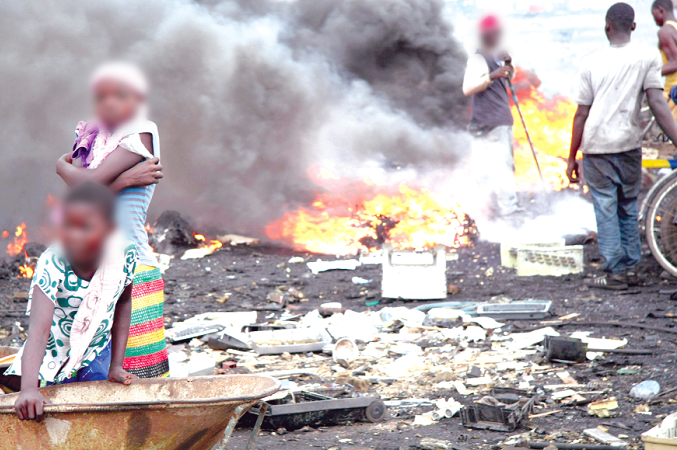 Burning e-waste at Agbogbloshie in Accra