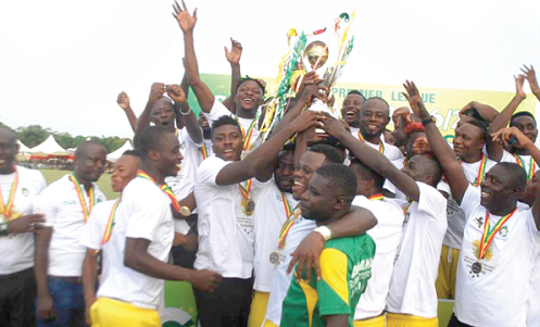 Players and officals of Aduana Stars celebrate with the GPL trophy after the coronation last sunday.
