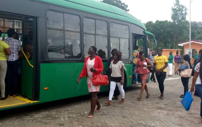 passengers boarding a BRT bus