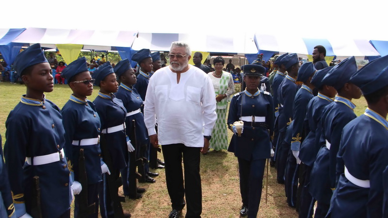 The former President inspecting a guard of honour by the school cadet.