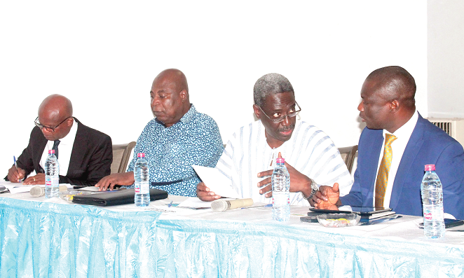 Mr Kwaku Kwarteng (right) conferring with Nana Agyekum Dwamena (2nd right), the Head of the Civil Service. Also in the photograph are Mr Ishmael Ashitey (2nd left), the Greater Accra Regional Minister, and Dr Nana Ato Arthur, the Head of Local Government Services. Picture: Maxwell Ocloo