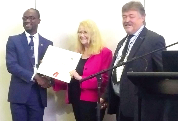 Mr Ben Bonsu (left) receiving a certificate from Ms Lyn D. Wigbels, a Senior Fellow and Assistant Professor at the Centre for Aerospace Policy Research at George Mason University. With them is Christophe Bonnal, a Senior Expert from the French Space Agency