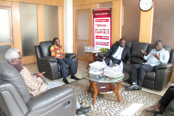  Mr Mohammed Adjei Sowah (right), the Chief Executive of the Accra Metropolitan Assembly (AMA), explaining a point to Mr Kenneth Ashigbey (2nd right), Managing Director, Graphic Communications Group Limited (GCGL), during a visit to his office. Those with them are some officials of GCGL. Picture: EDNA ADU-SERWAA