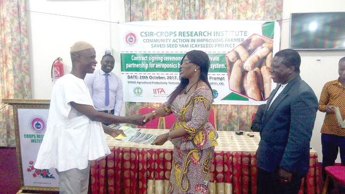 A seed grower receiving the agreement from an official of CSIR