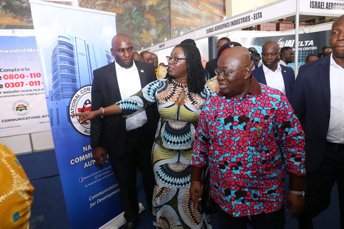 Mrs Ursula Owusu-Ekuful (3rd right), the Minister of Communications, conducting President Akufo-Addo round an exhibition after the event.