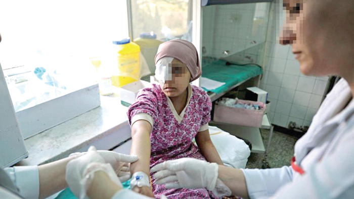  A doctor attending to a child with cancer