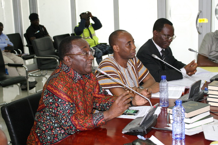 Dr Owusu Afriyie Akoto (left) answering questions at the Public Accounts Committee sitting 