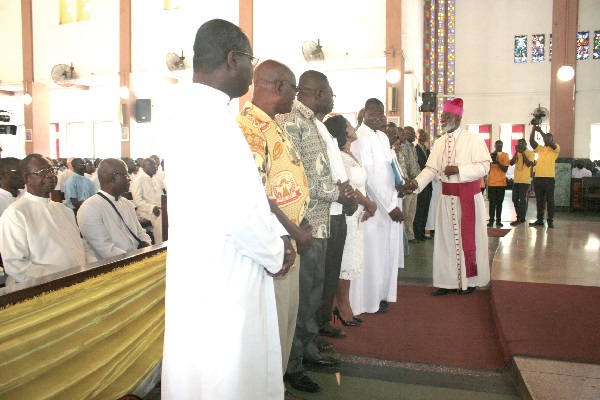 Most Rev. Charles Gabriel Palmer-Buckle (right), Archbishop of Accra, shaking hands with  members of the planning committee for the anniversary. Picture: INNOCENT K. OWUSU