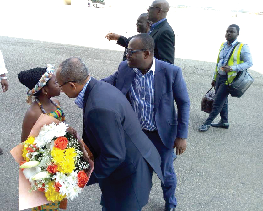 CAF President Ahmad Ahmad is welcomed with a bouquet of flowers at the Kotoka International Airport on his arrival in Accra 