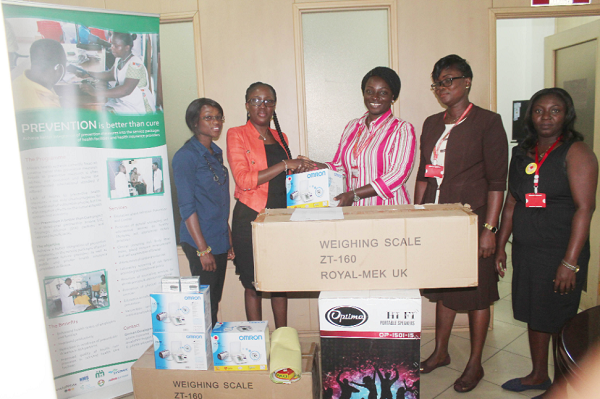  Ms Juliette Edzeame (2nd left), Project Manager of PBC, GIZ, presenting the items to Dr Jacqui Barnes (middle). Those with them are officials of GCGL and GIZ. Picture: EDNA ADU-SERWAA