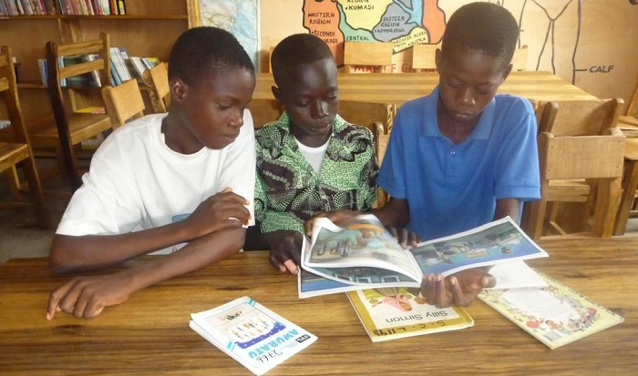 Some school children reading their books (library photo)