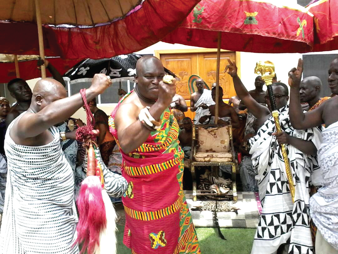 Odeneho Akoto III (middle) responding to cheers during the launch of the homecoming event