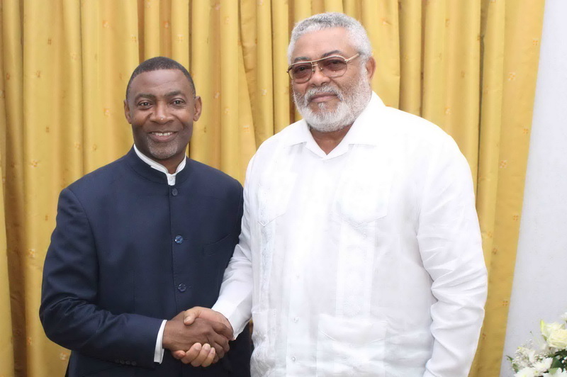 Rawlings and Lawrence Tetteh in a handshake