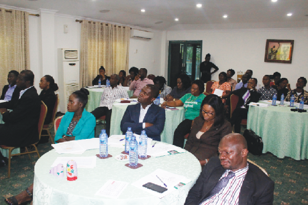 Participants attentively listening   to their facilitator at a master class training on emotional management