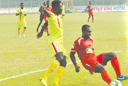 Kotoko’s Obed Owusu slips after a challenge from his Eleven Wonders marker Picture: James Baah
