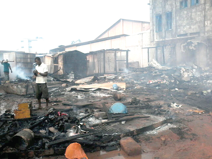 Some of the affected persons salvaging what is left after the inferno 
