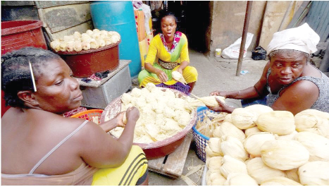 Kenkey being prepared with bare hands to be sold for consumption