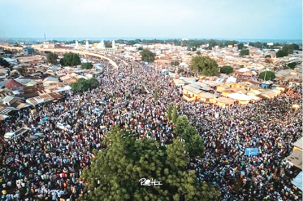 Aerial view of the principal streets of Tamale, filled with revelers in a procession