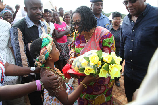 First Lady Lordina Mahama receives a bouquet on arrival at Bamionko for the inauguration of the Gwiraman Community SHS