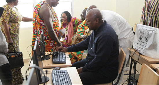 President Mahama trying out one of the computers in the ICT lab of the school