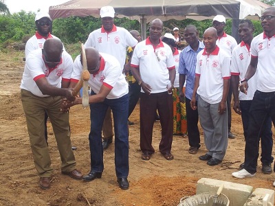 Mr Donkoh (left) and Prof. Anamuah-Mensah (right) jointly peforming the sod-cutting marking the commencement of the construction of JUC branch in Cape Coast.  Looking on are members of staff of JUC.