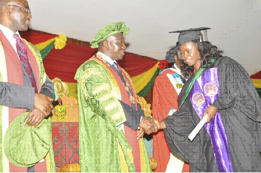 Otumfuo Osei Tutu congratulating Ms Gifty Esi Anaman on receiving First Class Honour.    