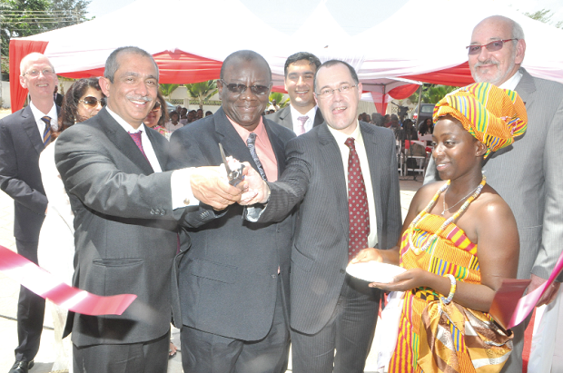 Mr Kwame Dattey (2nd left), being assisted by Professor Mark E. Smith (3rd right), and Mr Rakesh Wahi (left), Chairman CMA, Investment Holding, to inaugurate the new campus for Lancaster University in Accra. INSET:  The newly constructed building for the university. Picture: GABRIEL AHIABOR