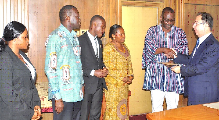 Mr Ali Halabi (right), Ambassador of Lebanon in Ghana, presenting a scholarship package to Prof W. O. Ellis, the Vice-Chancellor of KNUST.  With them are (from left) Ms Henrietta Wontaga, a beneficiary; Dr Oswald Seneadza, the Vice Dean of the Faculty of Law, KNUST; Mr Nicholas Anane Adjei Lenin, a beneficiary, and Dr Morhe of the Law Faculty of KNUST.
