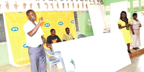 MTN staff replace blackboards at Bechem School for the Deaf.