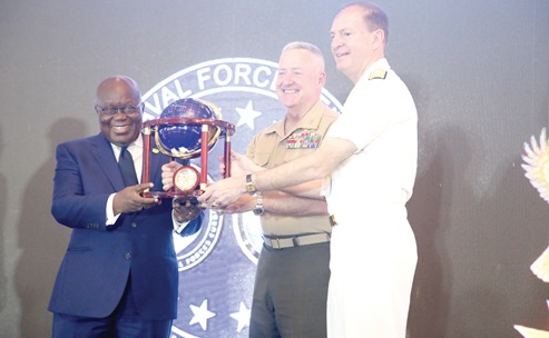 President Akufo-Addo (left) receiving a gift from Major General Robert B. Sofge (2nd from right), a Security Chief from the US, and Admiral Munsch Stuart, Commander of US Naval Forces, Europe, and Africa, at the summit in Accra. Picture: SAMUEL TEI ADANO