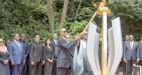 Rwandan President Paul Kagame lights the perpetual flame in remembrance of the victims of the 1994 genocide
