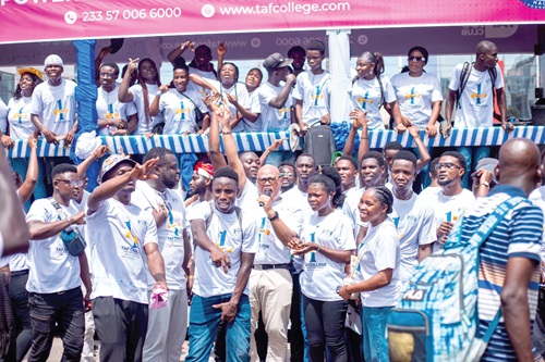 Rev Johnnie Oquaye (with mic), Founder, The African Freelancers College, and some of the students, including the former illegal miners, during the anniversary float