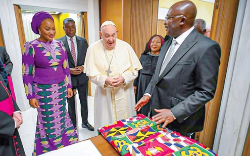 Dr Mahamudu Bawumia (right) presenting a kente cloth as a gift to Pope Francis. With him include Samira Bawumia (left), wife of Dr Bawumia