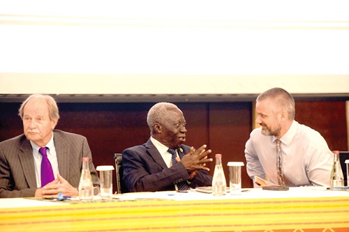 Yaw Osafo-Maafo (middle), Senior Presidential Advisor, in a chat with Richard Sandall, Development Director, British High Commission in Ghana at the stakeholders meeting on revitalising infrastuture investments in Ghana. With them is Christian J. Poortman, Board Chairman, Construction Sector Transparency Initiative