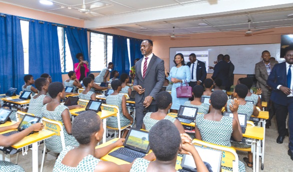 Tony Mwaba Kazadi (arrowed), DRC Minister of Primary, Secondary and Technical Education, leading his team to inspect an ICT class  in progress at Accra Girls SHS