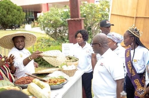  Kwasi Agyeman (2nd from right), CEO, Ghana Tourism Authority, and other dignitaries sampling some food on display