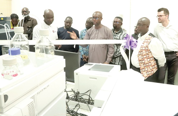  Dr Paul Fosu (3rd from left), Head of Food and Agic Laboratory, GSA, explaining the use of the equipment and its functions to John C. Duti (2nd from right), Team Leader, Invest for Job, GIZ; Prof. Felix Charles Mills-Robertson (3rd from right), Chairman of the GSA Governing Board, and other participants during the event. Picture: EDNA SALVO-KOTEY