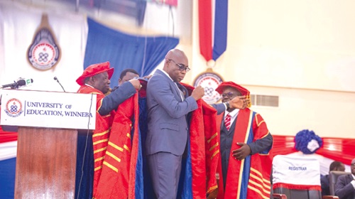  Prof. Stephen Jobson Mitchual being robed by Neenyi Ghartey (right), Chancellor, UEW, and Nana Ofori Ansah (left), Chairman of the Governing Council 